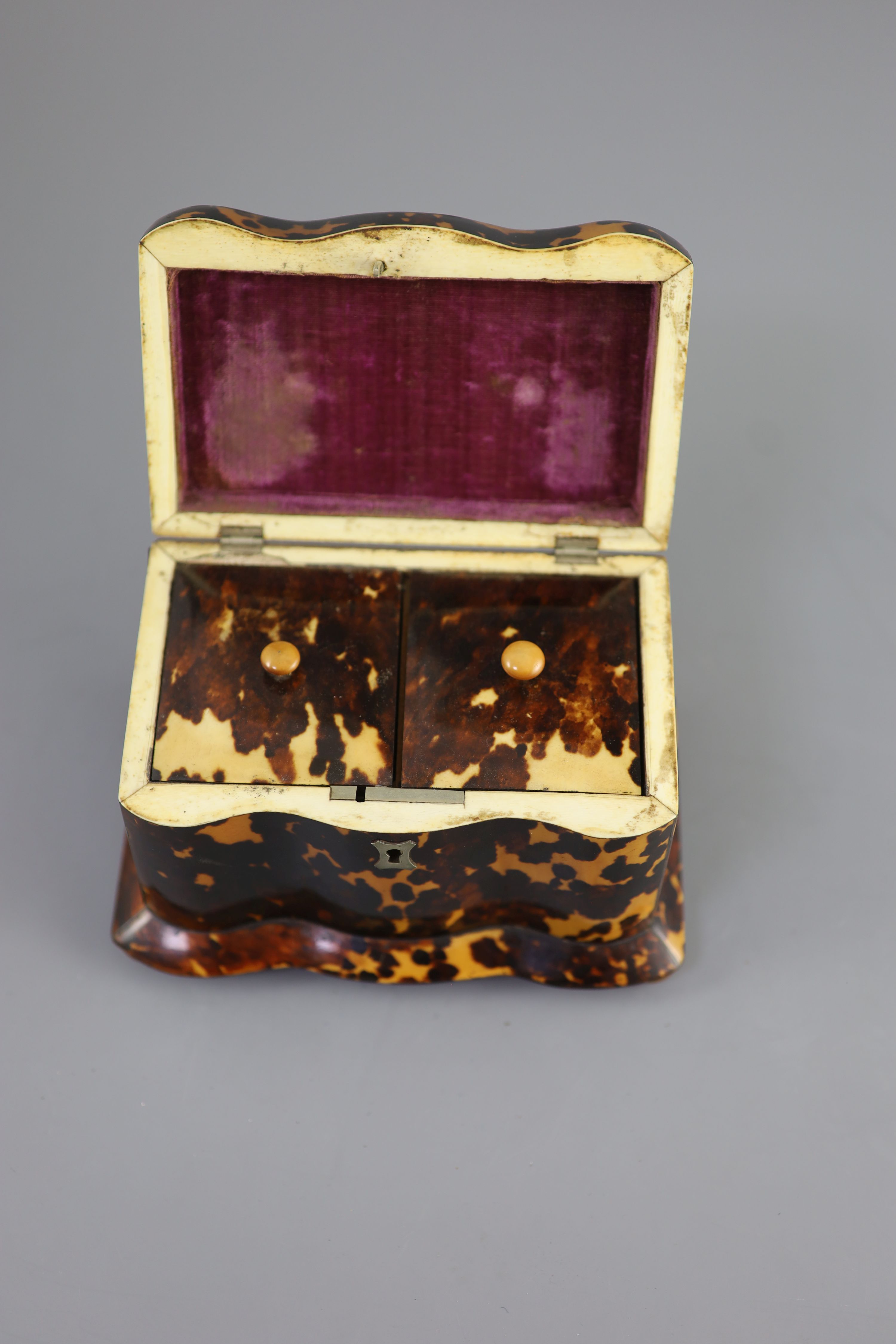 A 19th century tortoiseshell tea caddy, 18cm wide, 11cm deep, 11.5cm high.